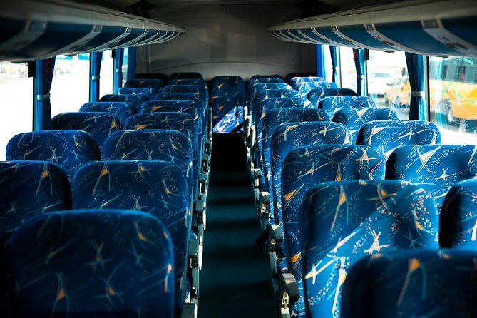 Airport Air Conditioning Bus transfer - Finding your name at national or international arrivals