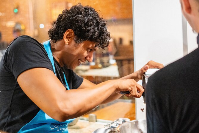 Bean to Bar Chocolate Making Experience - by Lunático Experience - Grinding cacao into paste and refining the mixture
