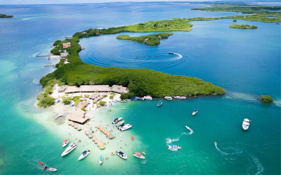Cartagena: 5 Island Boat Tour with Night Bioluminescent Stop - Isla Grande brings the clearest water and coral