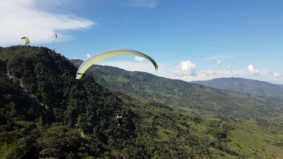 From Medellin: Private Paragliding Tour Over Waterfalls - The tandem flight above the waterfalls