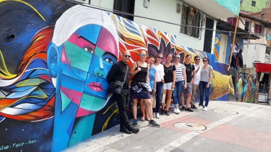 Medellín: Comuna 13 District Tour with Cable Car Ride - Walking through Comuna 13’s murals and street life