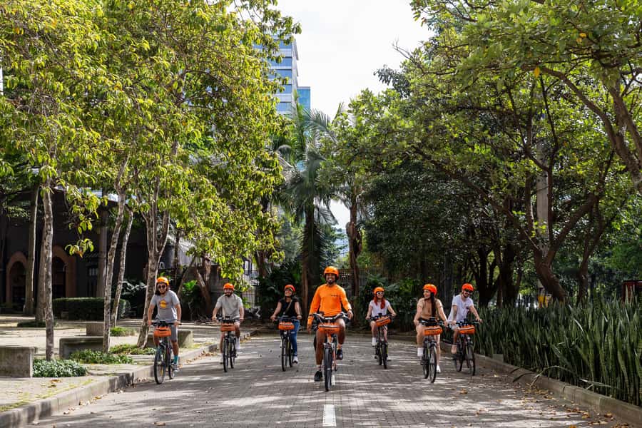 Medellín: E-bike and Foodie Tour - Parque Belén, where daily life takes over