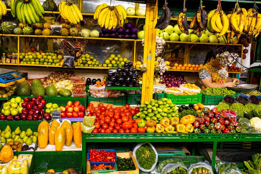 Medellín Multi-sensory Tour in the market, +15 Exotic Fruits - Meeting at Puerta 1 with the purple umbrella