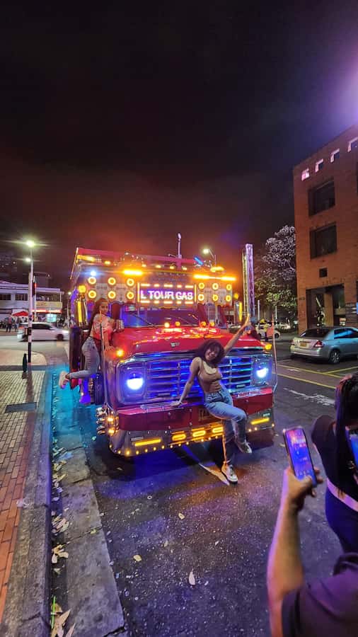 Medellin: Party Bus with DJ & Street Food Tastings - Meeting in El Poblado and getting the night started