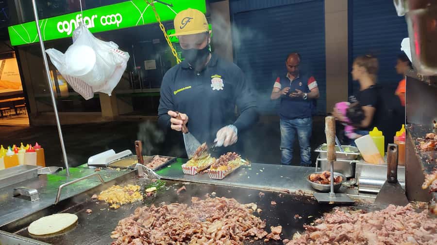 Medellin: Street Food and Poblado Rooftop Tour with a Local - Meeting the vendors behind the food