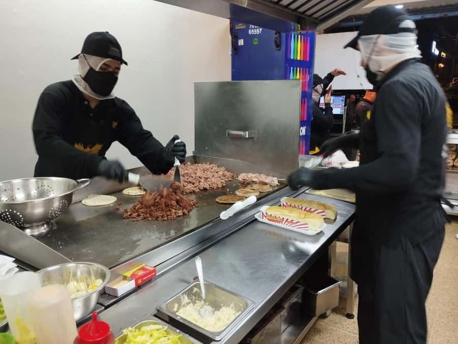Medellin: tasting Street Food with Rooftops of El Poblado - Walking through El Poblado after dark