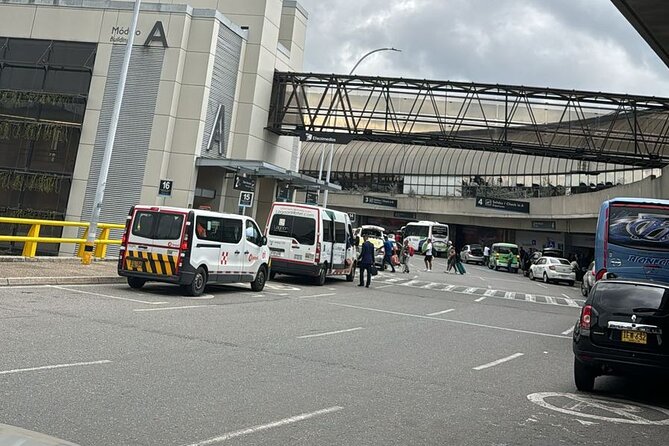 Private transfer service from or to Medellín Airport - Door 5 is upstairs, not at arrivals