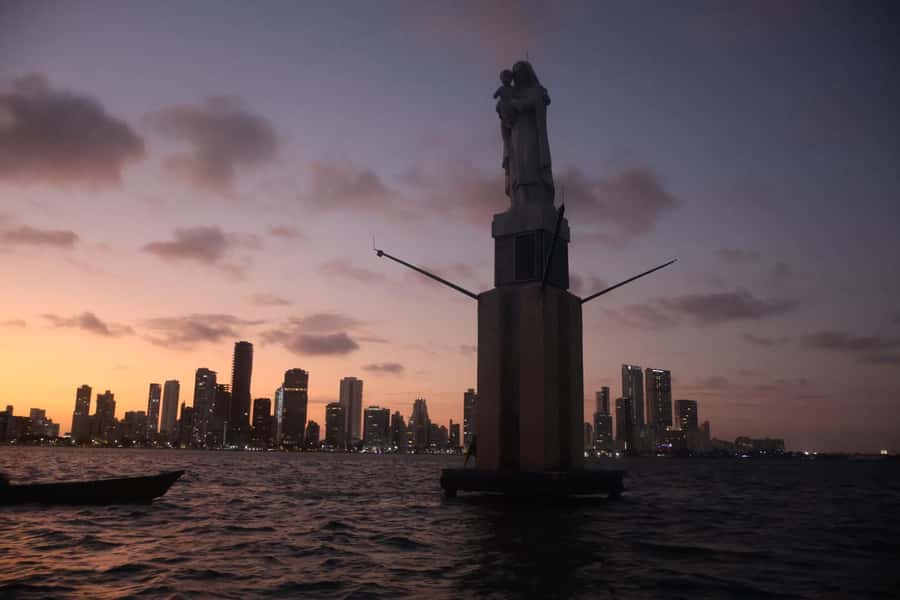 Sunset Party open bar on the bay while sharing with locals - Leaving Cartagena’s main bay by boat